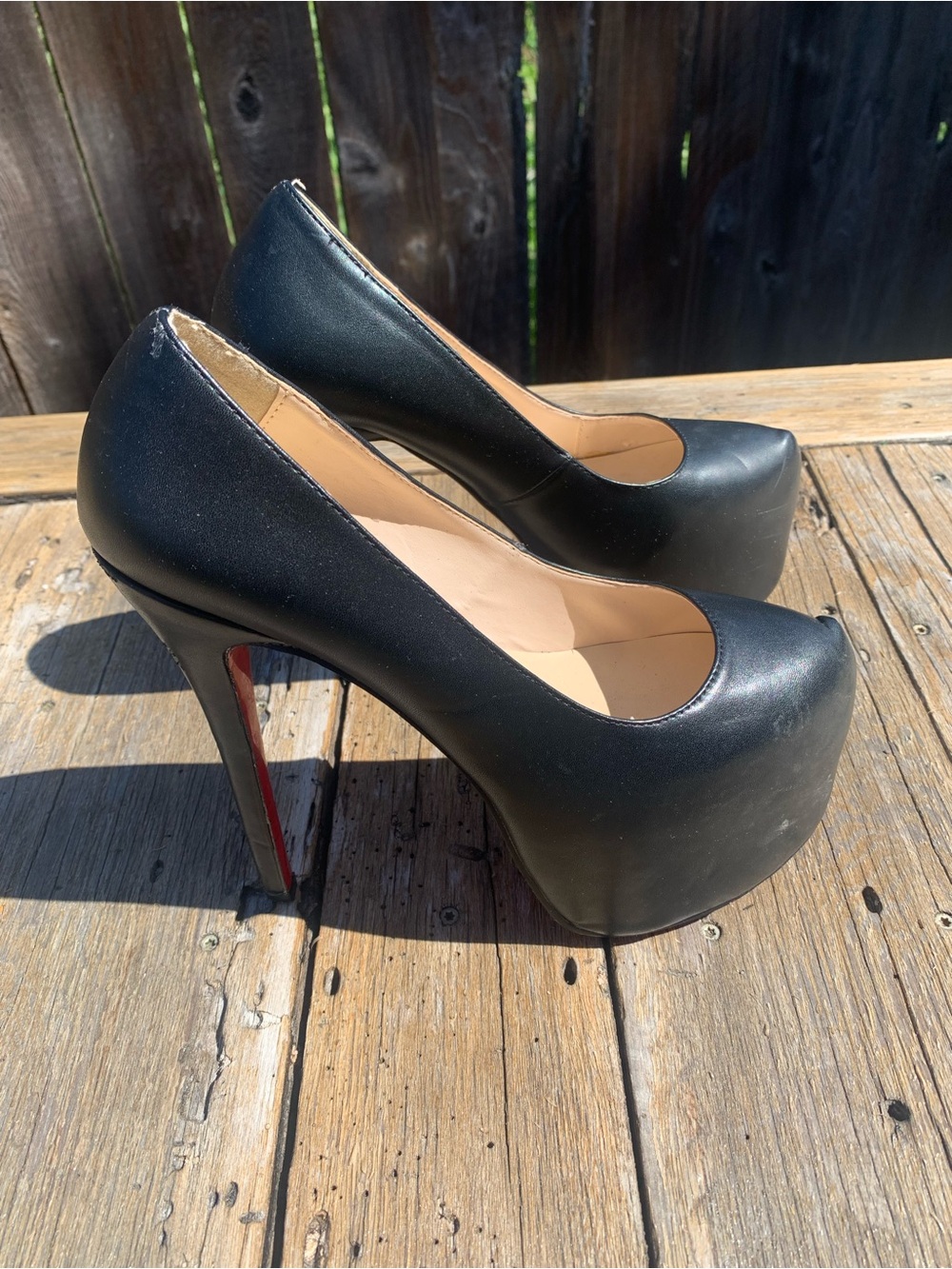 Christian Louboutin Black Platform Pumps with Signature Red Soles